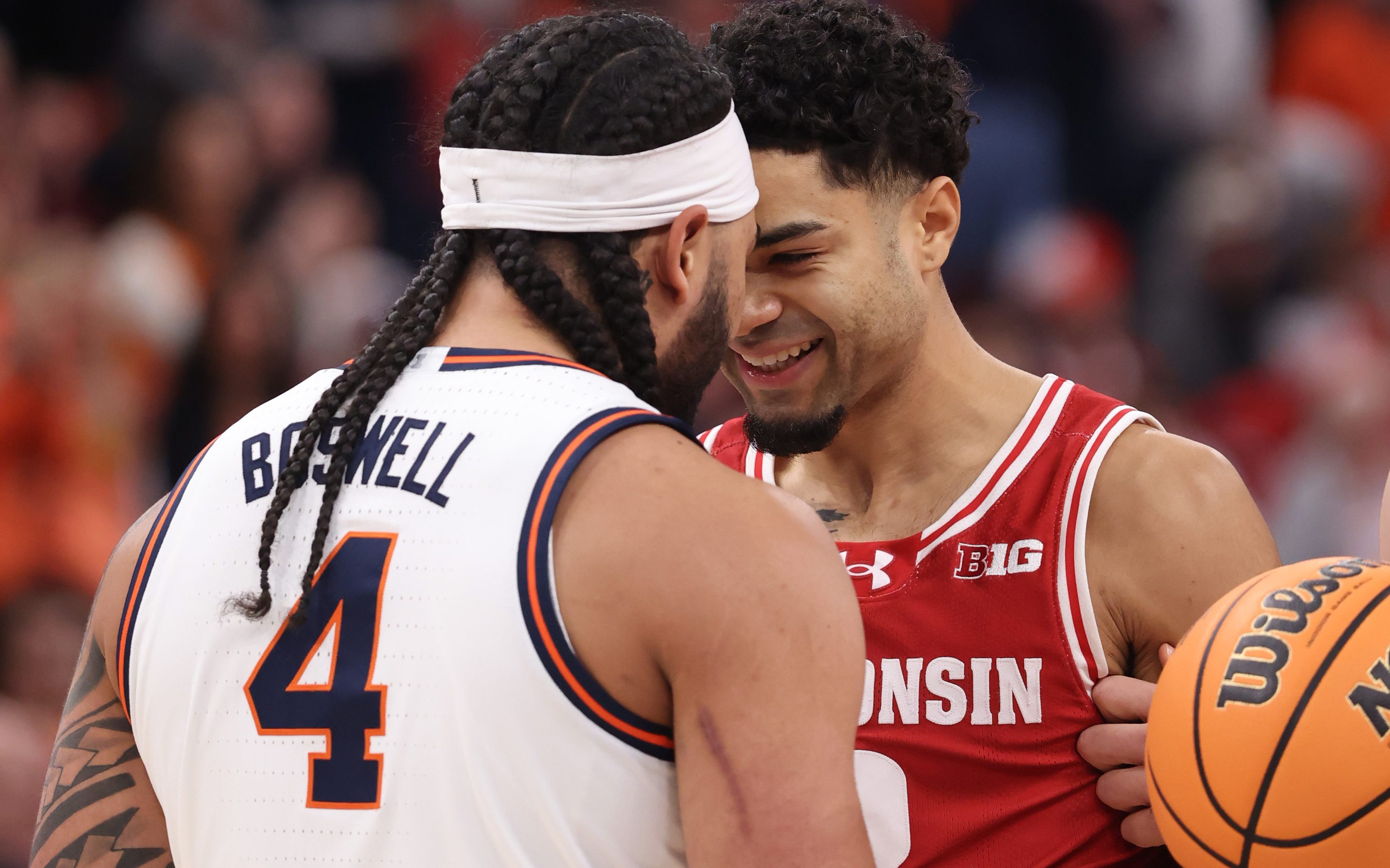 Illinois guard Kylan Boswell, left, and Wisconsin guard Nick Boyd...