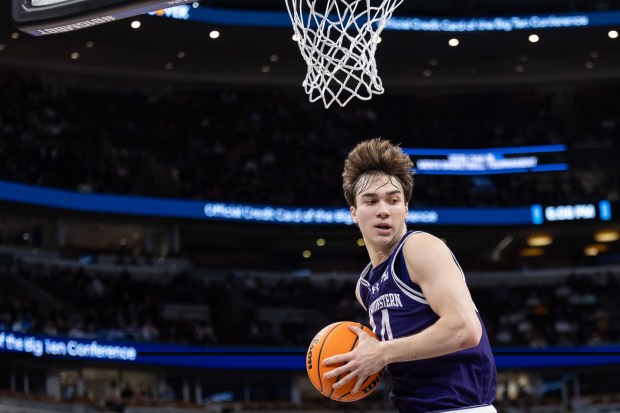 Northwestern guard Angelo Ciaravino grabs a rebound in the first half during the Big Ten Tournament Thursday, March, 12, 2026, at the United Center. (Josh Boland/Chicago Tribune)