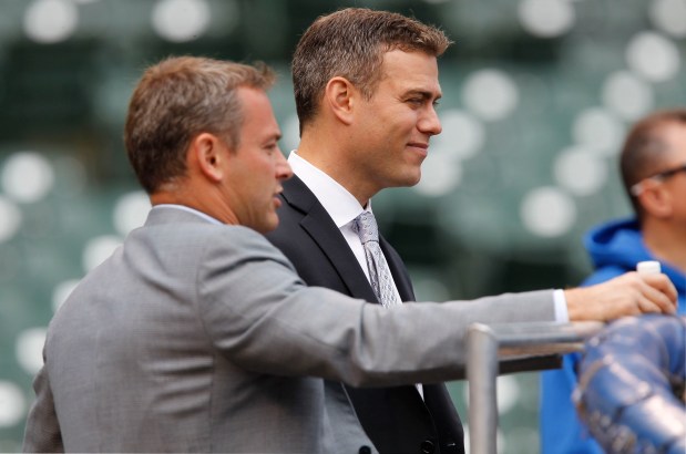 Cubs GM Jed Hoyer, left, and President Theo Epstein watch batting practice before the home opener against the Brewers on April 8, 2013, at Wrigley Field. (Jose M. Osorio/ Chicago Tribune)