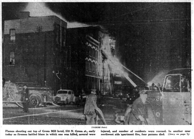 Flames from a fire at the Green Mill hotel, 518 N. Green St., Chicago, shoot up through its roof and could be seen from the Loop on on April 28, 1955. (Chicago Tribune)