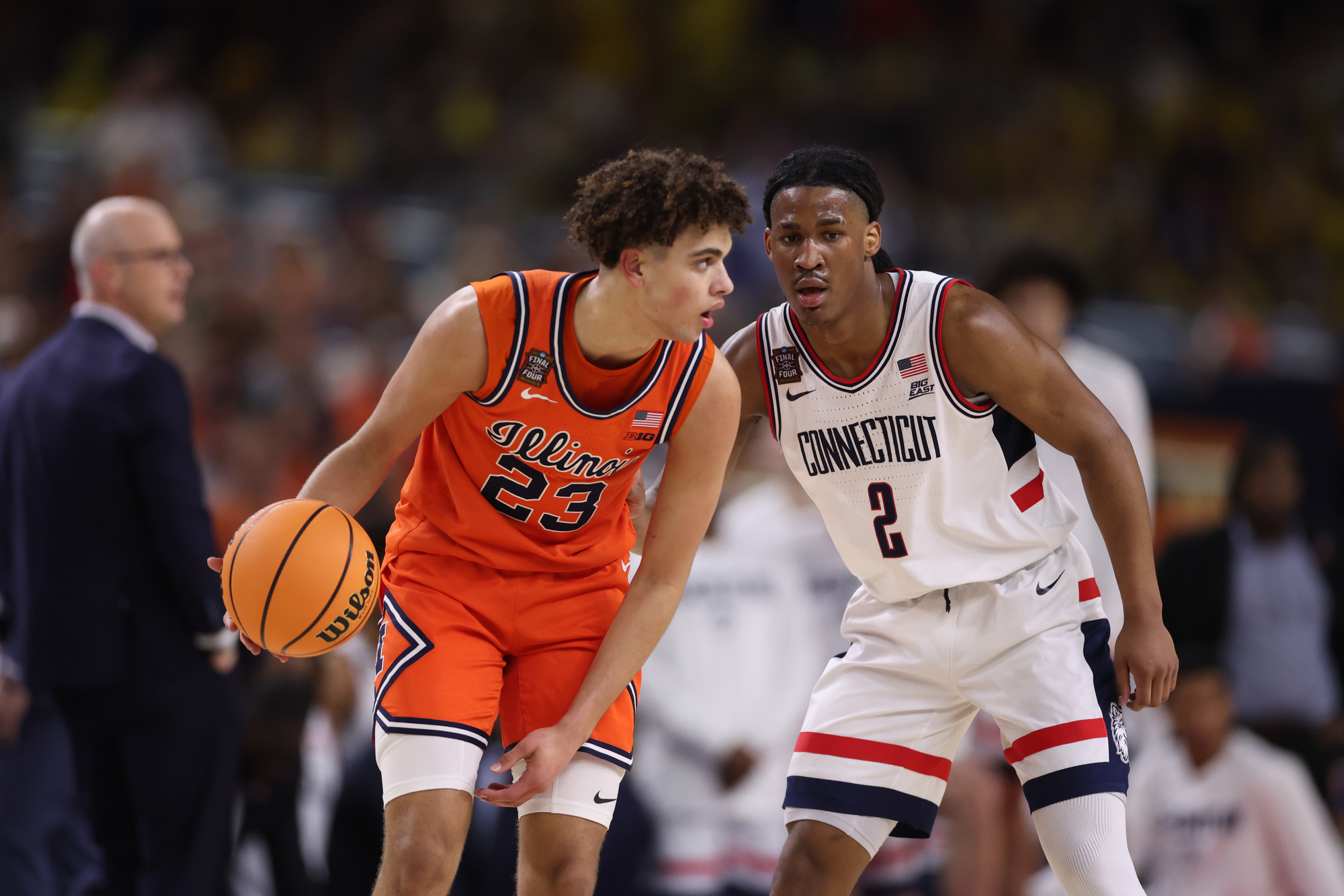 Illinois guard Keaton Wagler (23) works against UConn guard Silas...