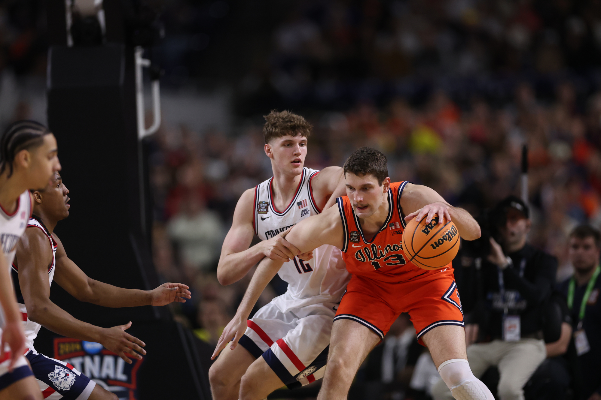 Illinois center Tomislav IviÅ¡iÄ (13) works against UConn center Eric...