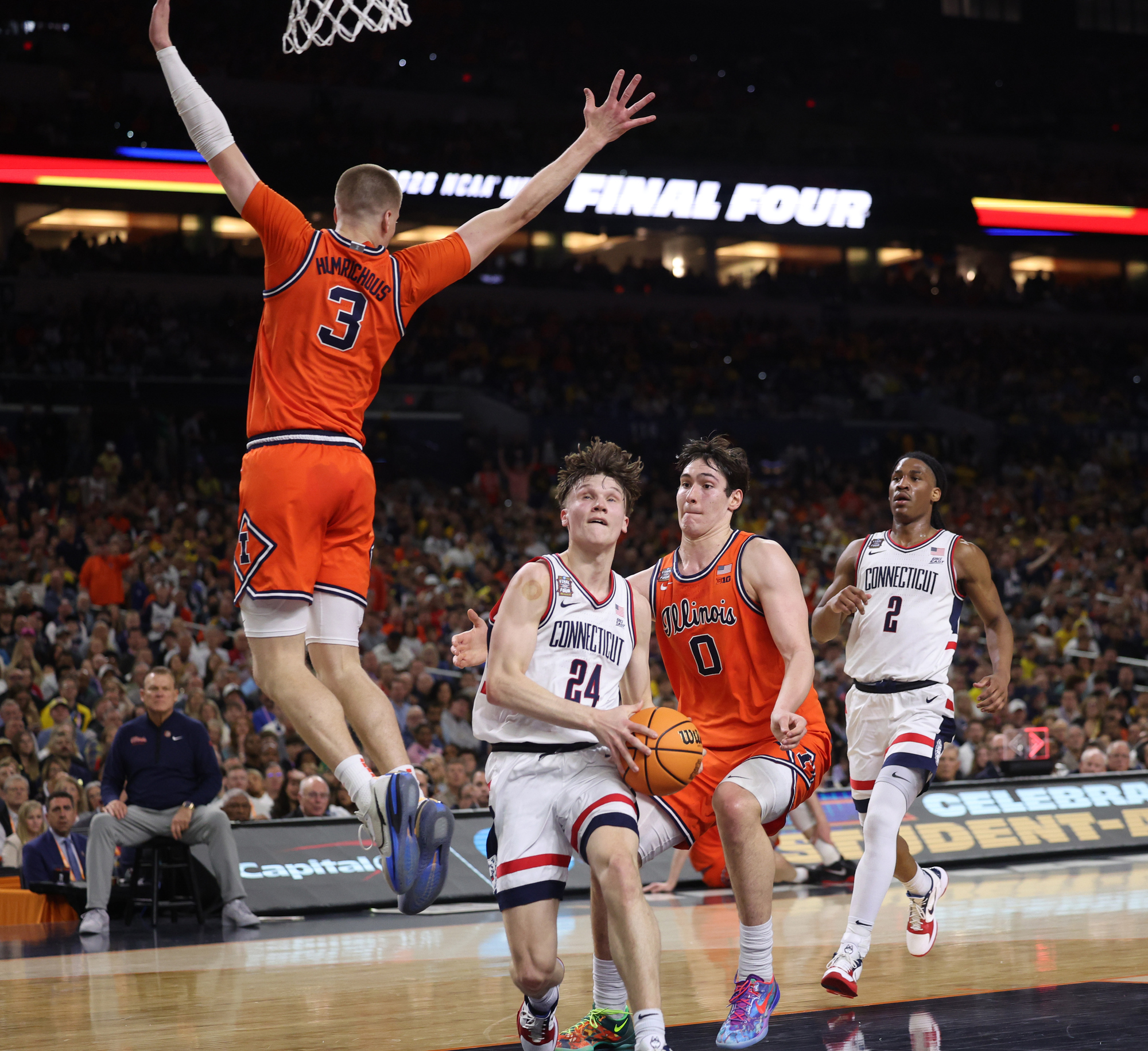 Illinois forwards Ben Humrichous (3) and David MirkoviÄ try to...