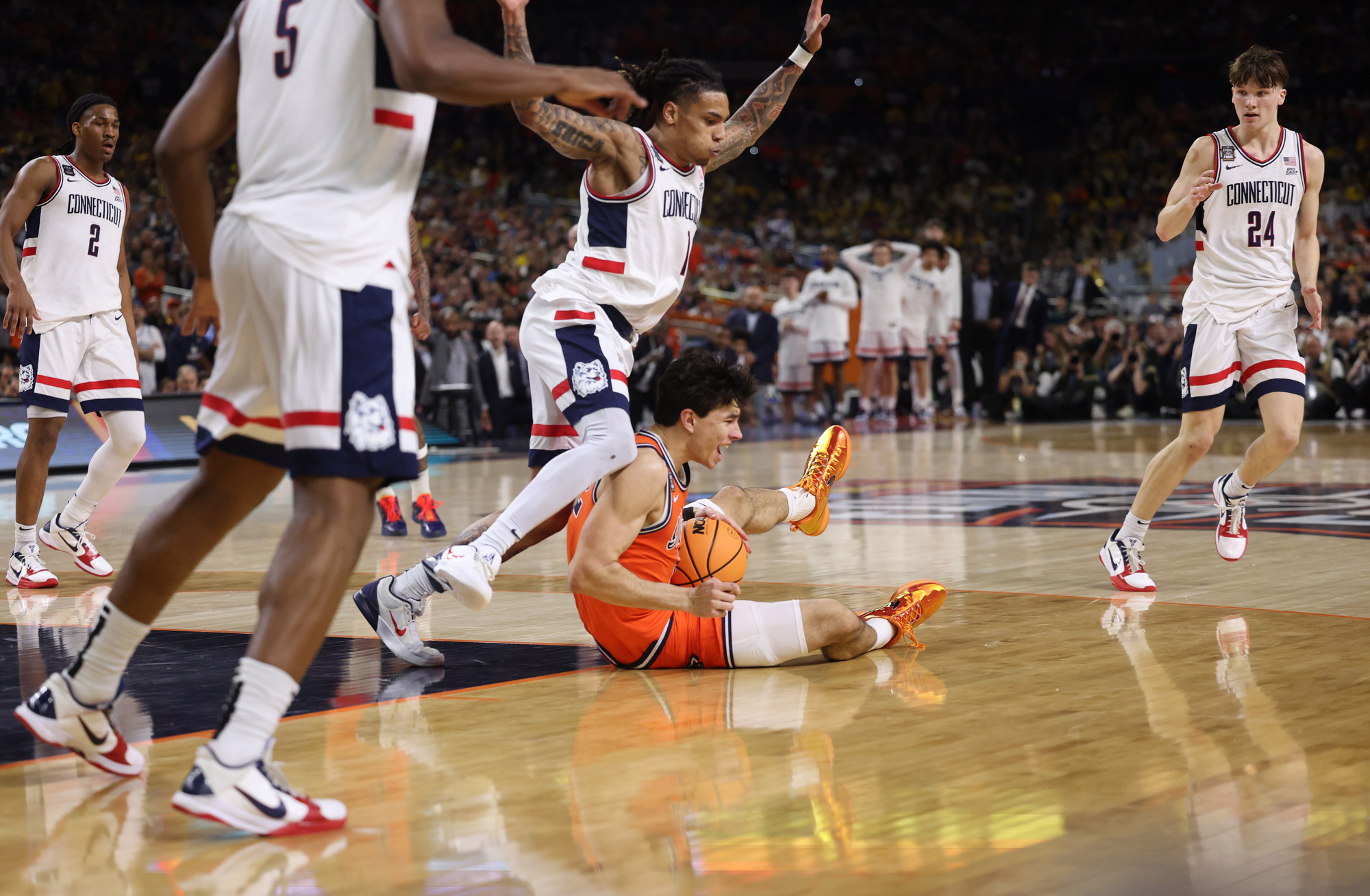 UConn guard Solo Ball (1) fouls Illinois guard Andrej StojakoviÄ...