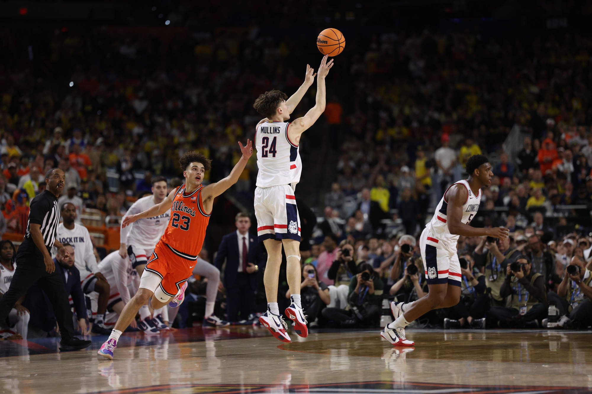UConn guard Braylon Mullins (24) hits a 3-point shot in...