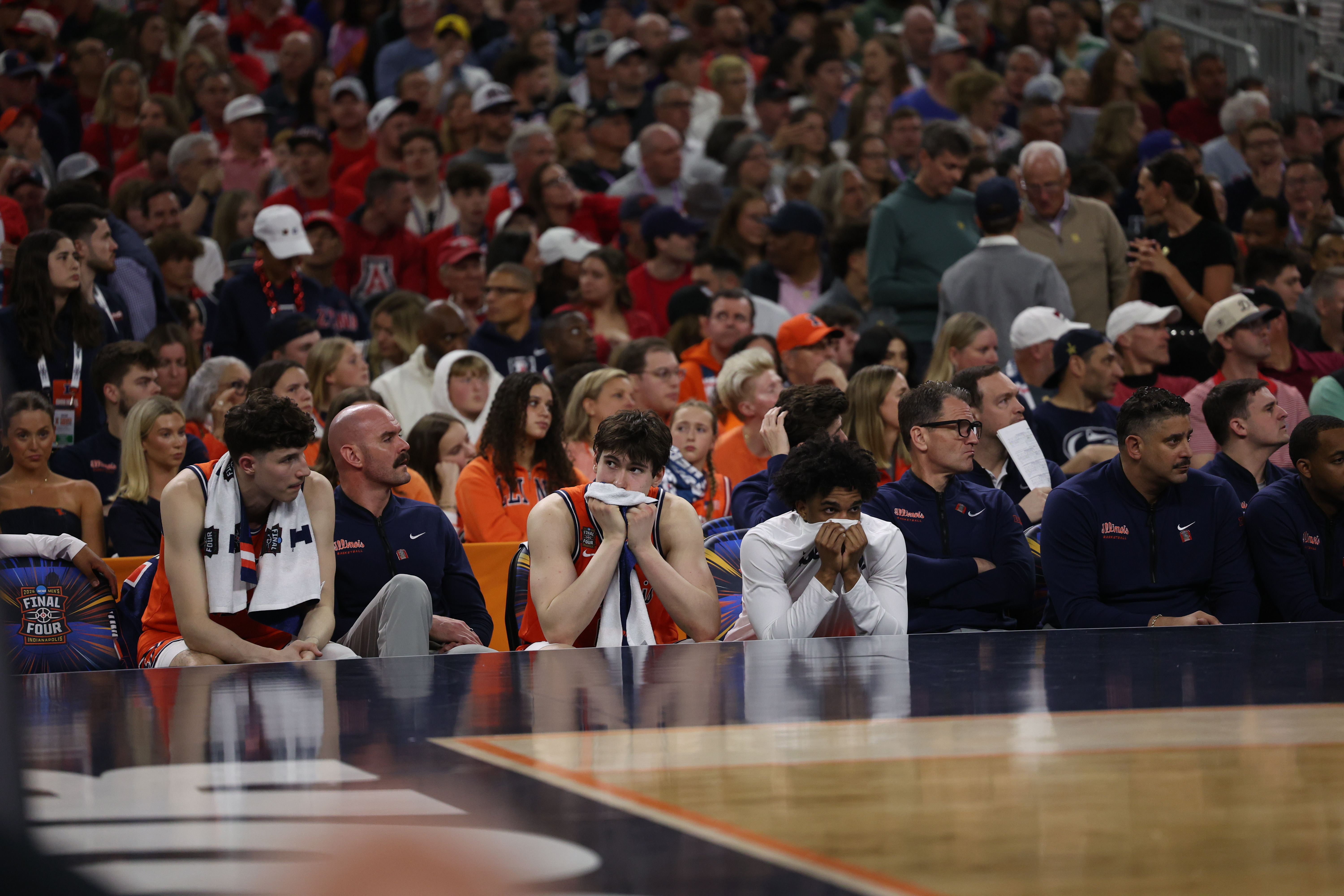 Illinois players watch from the bench in the final minute...