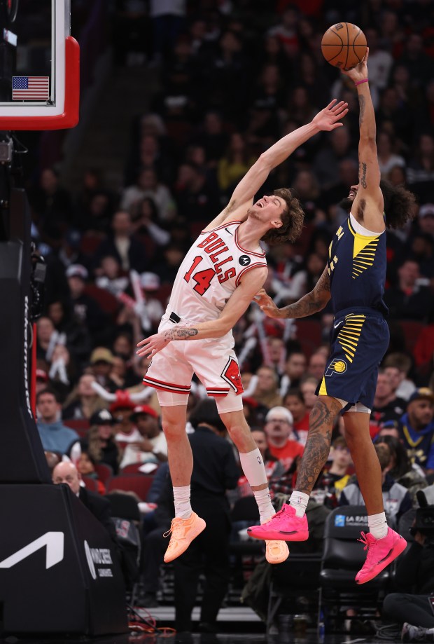 Indiana Pacers forward Obi Toppin (1) secures a rebound behind Chicago Bulls forward Matas Buzelis (14) in the second half of a game at the United Center in Chicago on April 1, 2026. (Chris Sweda/Chicago Tribune)