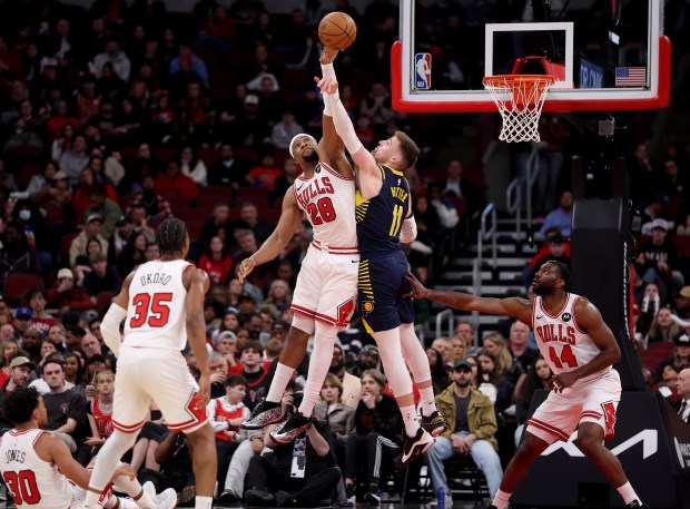 Chicago Bulls forward Guerschon Yabusele (28) and Indiana Pacers center Micah Potter (11) battle for a rebound in the second half of a game at the United Center in Chicago on April 1, 2026. (Chris Sweda/Chicago Tribune)