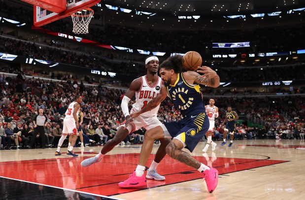 Indiana Pacers forward Obi Toppin (1) loses the ball while driving on Chicago Bulls forward Leonard Miller (11) in the first half of a game at the United Center in Chicago on April 1, 2026. (Chris Sweda/Chicago Tribune)