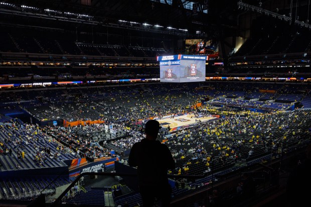 Fans take their seats before the NCAA title game between UConn and Michigan April 6, 2026, at Lucas Oil Stadium in Indianapolis. (Armando L. Sanchez/Chicago Tribune)