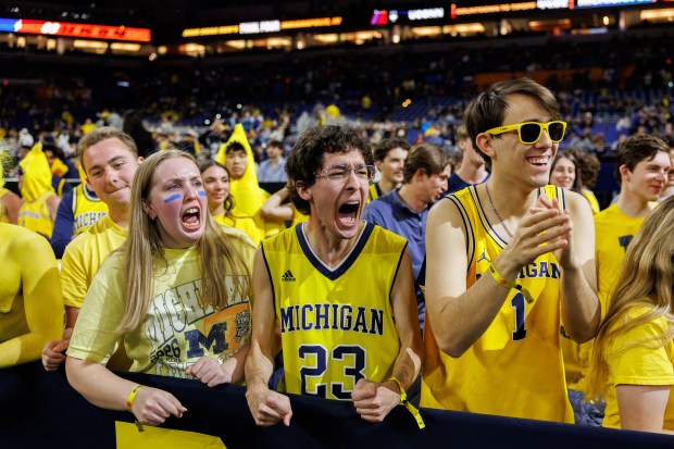 Michigan fans cheer before the NCAA title game between UConn and Michigan on April 6, 2026, at Lucas Oil Stadium in Indianapolis. (Armando L. Sanchez/Chicago Tribune)
