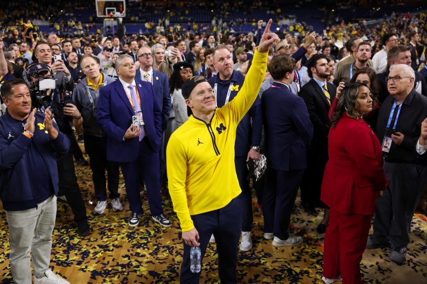 Michigan head coach Dusty May celebrates after defeating UConn, 69-63, in the NCAA title game on April 6, 2026, at Lucas Oil Stadium in Indianapolis. (Armando L. Sanchez/Chicago Tribune)