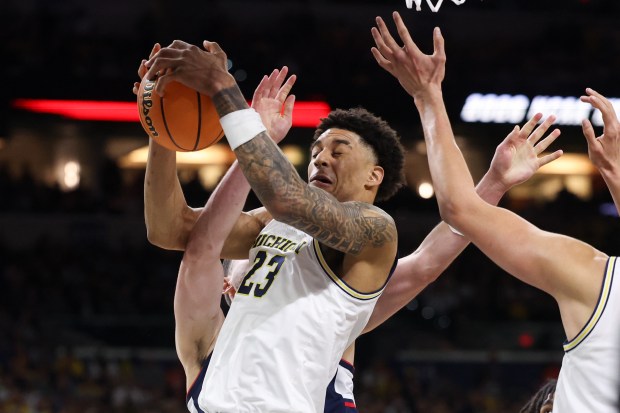 Michigan forward Yaxel Lendeborg (23) grabs a rebound during the second half of the NCAA title game between UConn and Michigan April 6, 2026, at Lucas Oil Stadium in Indianapolis. (Armando L. Sanchez/Chicago Tribune)