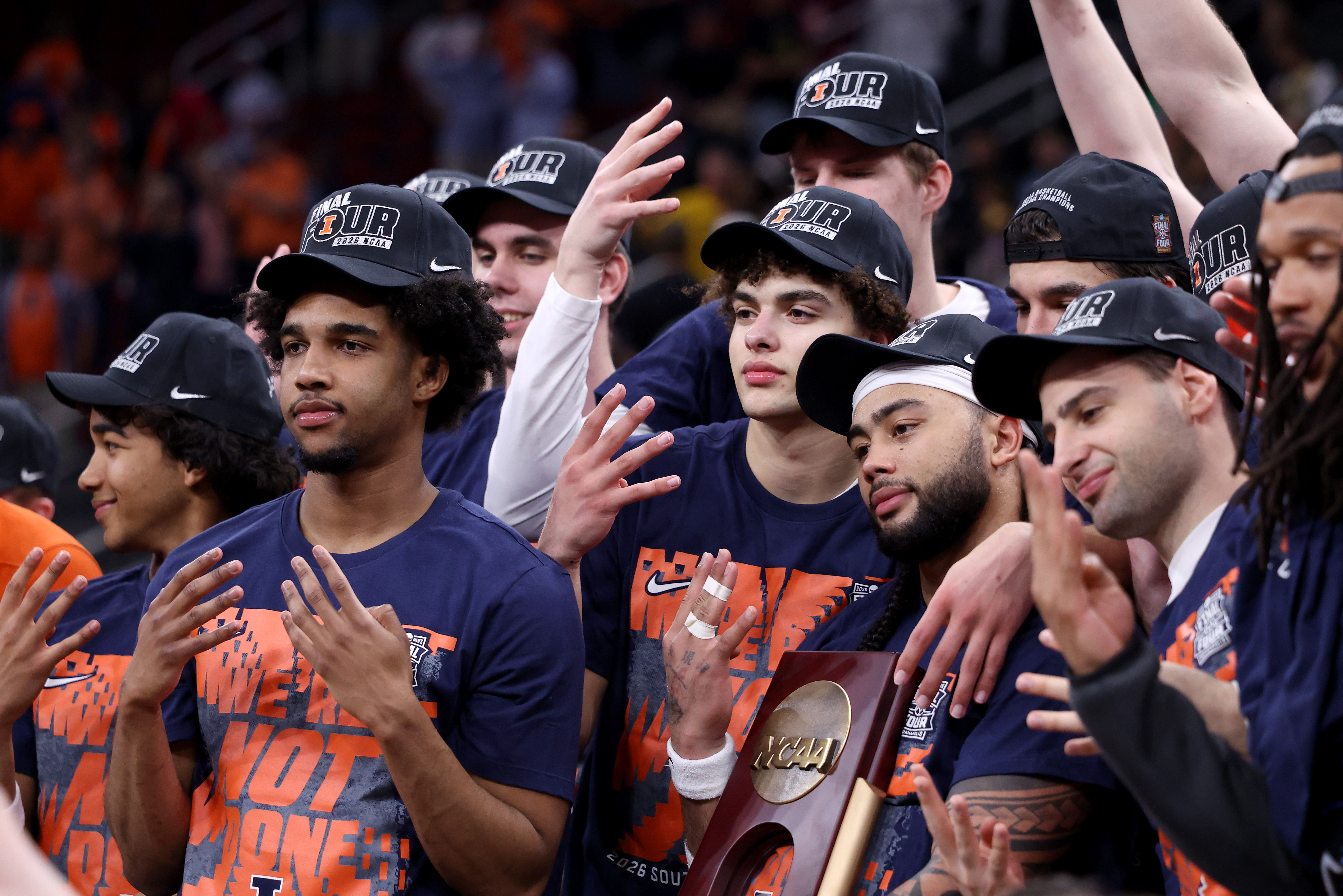 Keaton Wagler, Kylan Boswell and their Illinois teammates pose with...