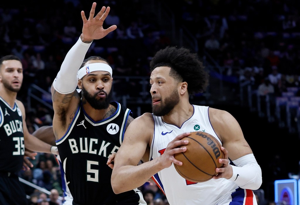 Returning star guard Cade Cunningham drives on Milwaukee's Gary Trent Jr. during the Piston-Bucks game on April 8, 2026 in Detroit.