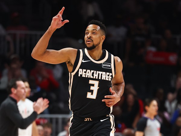 Hawks clinch a playoff spot and Southeast Division behind 29 points from McCollum in rout of Cavs