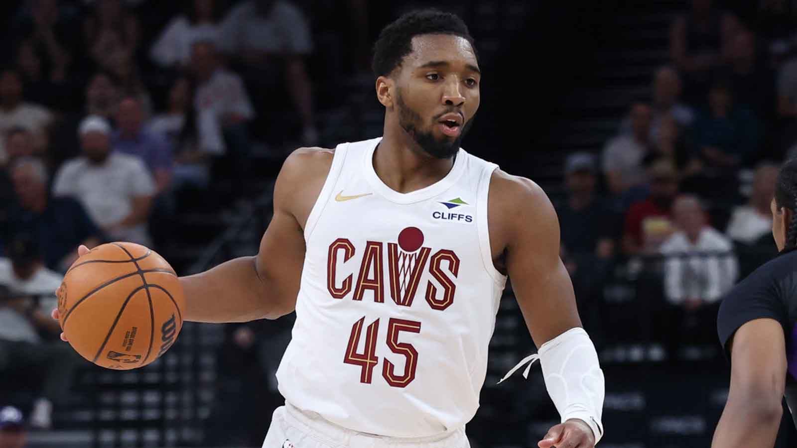 Cavs guard Donovan Mitchell (45) brings the ball up the court against the Utah Jazz during the second half at Delta Center