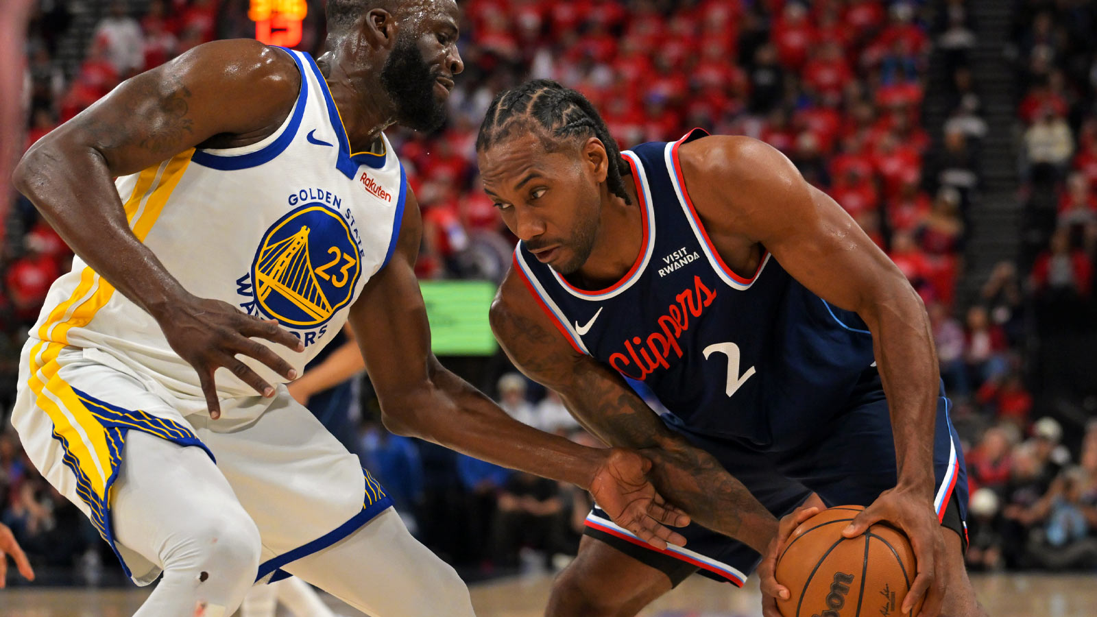 Warriors forward Draymond Green (23) guards Los Angeles Clippers forward Kawhi Leonard (2) in the first half during the play-in rounds of the 2026 NBA Playoffs at Intuit Dome