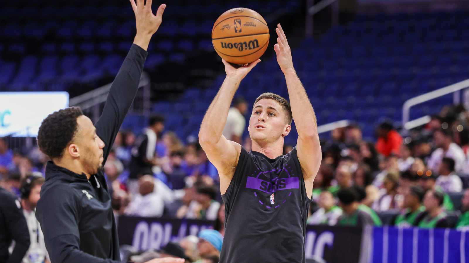 Phoenix Suns guard Collin Gillespie (12) warms up before a game against the Orlando Magic at Kia Center.