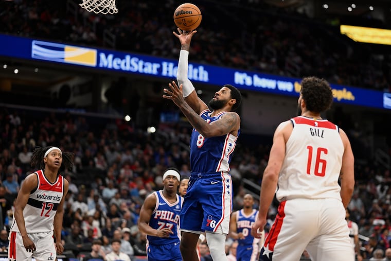 Philadelphia 76ers forward Paul George (8) goes to shoot during the second half of an NBA basketball game against the Washington Wizards, Wednesday, April 1, 2026, in Washington. (AP Photo/John McDonnell)