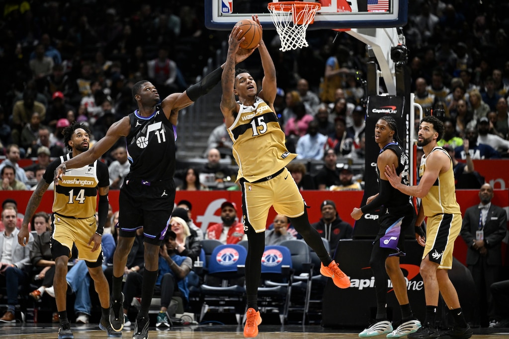 Washington Wizards forward Julian Reese (15) grabs a rebound against Utah Jazz center Mo Bamba during the first half of an NBA basketball game, Thursday, March 5, 2026, in Washington.