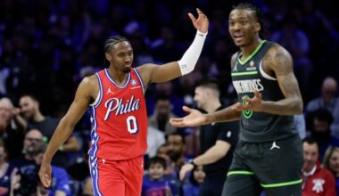 Sixers guard Tyrese Maxey waves to the Sixers crowd past Minnesota Timberwolves guard Bones Hyland at the end of the third quarter on Friday, April 3, 2026 in Philadelphia.