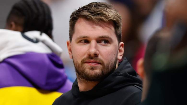 Luka Doncic of the Los Angeles Lakers looks on from the bench.