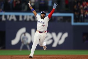 TORONTO, ONTARIO - NOVEMBER 01: Vladimir Guerrero Jr. #27 of the Toronto Blue Jays celebrates after Bo Bichette #11 hits a three-run home run against Shohei Ohtani #17 of the Los Angeles Dodgers during the third inning in game seven of the 2025 World Series at Rogers Center on November 01, 2025 in Toronto, Ontario. (Photo by Gregory Shamus/Getty Images)