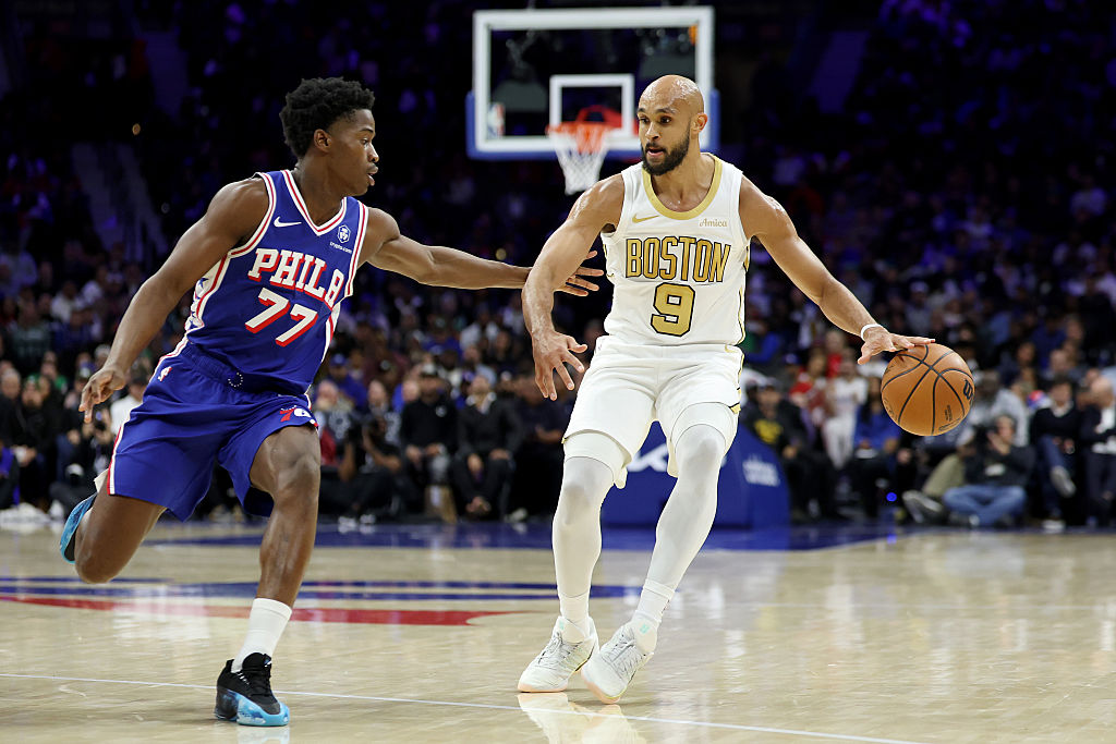 PHILADELPHIA, PENNSYLVANIA - NOVEMBER 11: Derrick White #9 of the Boston Celtics drives against VJ Edgecombe #77 of the Philadelphia 76ers during the second half at Xfinity Mobile Arena on November 11, 2025 in Philadelphia, Pennsylvania. NOTE TO USER: User expressly acknowledges and agrees that, by downloading and or using this photograph, User is consenting to the terms and conditions of the Getty Images License Agreement. (Photo by Emilee Chinn/Getty Images)