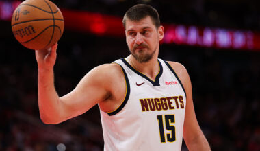 Nikola Jokic handles the ball during a Denver Nuggets game, featured in today’s NBA player prop parlays.