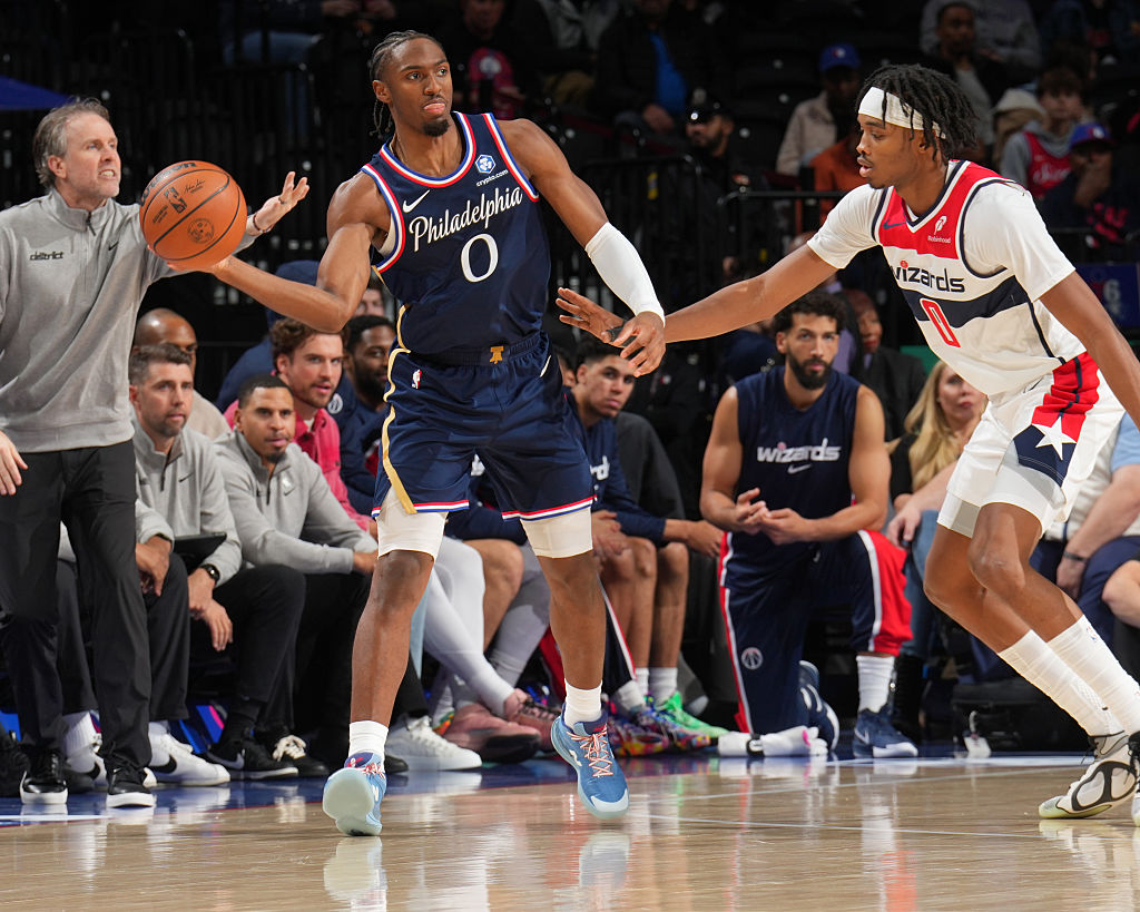 PHILADELPHIA, PA - DECEMBER 2: Tyrese Maxey #0 of the Philadelphia 76ers passes the ball as Bilal Coulibaly #0 of the Washington Wizards plays defense during the game on December 2, 2025 at the Wells Fargo Center in Philadelphia, Pennsylvania NOTE TO USER: User expressly acknowledges and agrees that, by downloading and/or using this Photograph, user is consenting to the terms and conditions of the Getty Images License Agreement. Mandatory Copyright Notice: Copyright 2025 NBAE (Photo by Jesse D. Garrabrant/NBAE via Getty Images)