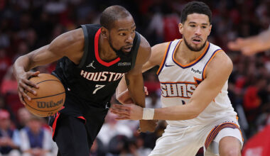 HOUSTON, TEXAS - JANUARY 05: Kevin Durant #7 of the Houston Rockets drives against Devin Booker #1 of the Phoenix Suns during the second half at Toyota Center on January 05, 2026 in Houston, Texas. NOTE TO USER: User expressly acknowledges and agrees that, by downloading and or using this photograph, User is consenting to the terms and conditions of the Getty Images License Agreement. (Photo by Alex Slitz/Getty Images)