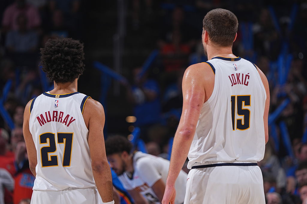 OKLAHOMA CITY, OK - MARCH 9: Jamal Murray #27 and Nikola Jokic #15 of the Denver Nuggets looks on during the game against the Oklahoma City Thunder on March 9, 2026 at Paycom Center in Oklahoma City, Oklahoma. NOTE TO USER: User expressly acknowledges and agrees that, by downloading and or using this photograph, User is consenting to the terms and conditions of the Getty Images License Agreement. Mandatory Copyright Notice: Copyright 2026 NBAE (Photo by Garrett Ellwood/NBAE via Getty Images)