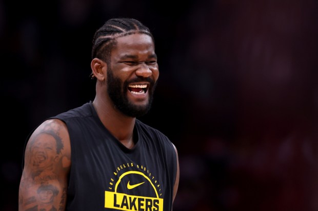 Lakers center Deandre Ayton laughs while warming up before a game against the Houston Rockets on March 18, 2026, in Houston. Ayton says he's excited to be back in the playoffs and doing so for the first time as a Laker. (Photo by Kenneth Richmond/Getty Images)