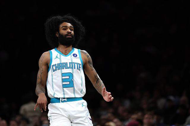 Coby White of the Charlotte Hornets looks on.
