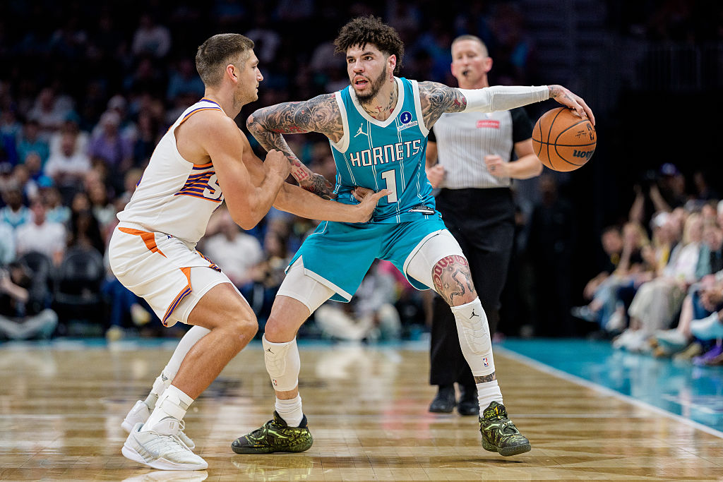 CHARLOTTE, NORTH CAROLINA - APRIL 02: LaMelo Ball #1 of the Charlotte Hornets brings the ball up court while guarded by Grayson Allen #8 of the Phoenix Suns in the first half during their game at Spectrum Center on April 02, 2026 in Charlotte, North Carolina. NOTE TO USER: User expressly acknowledges and agrees that, by downloading and or using this photograph, User is consenting to the terms and conditions of the Getty Images License Agreement. (Photo by Jacob Kupferman/Getty Images)