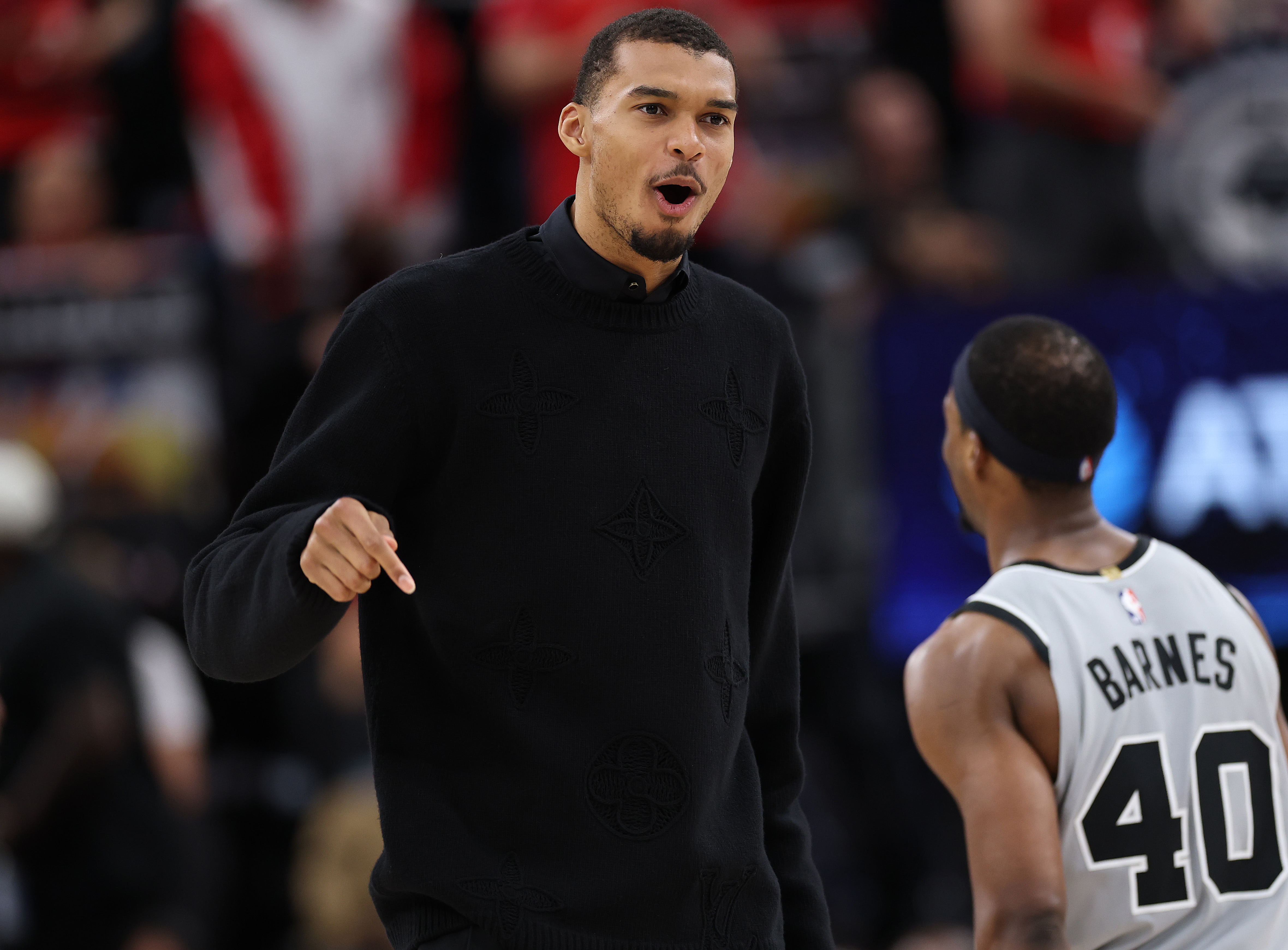 San Antonio Spurs star Victor Wembanyama, who sat out, reacts...