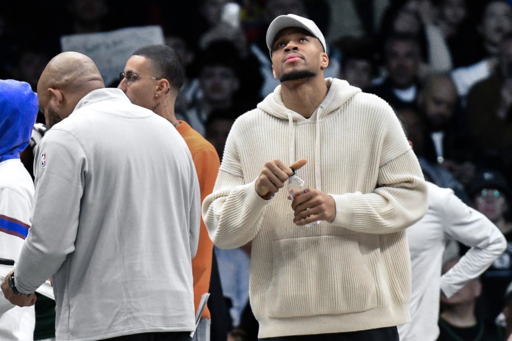 Giannis Antetokounmpo, who did not play, looks on during the Nets' 96-90 win over the Bucks on April 7, 2026 at Barclays Center. 