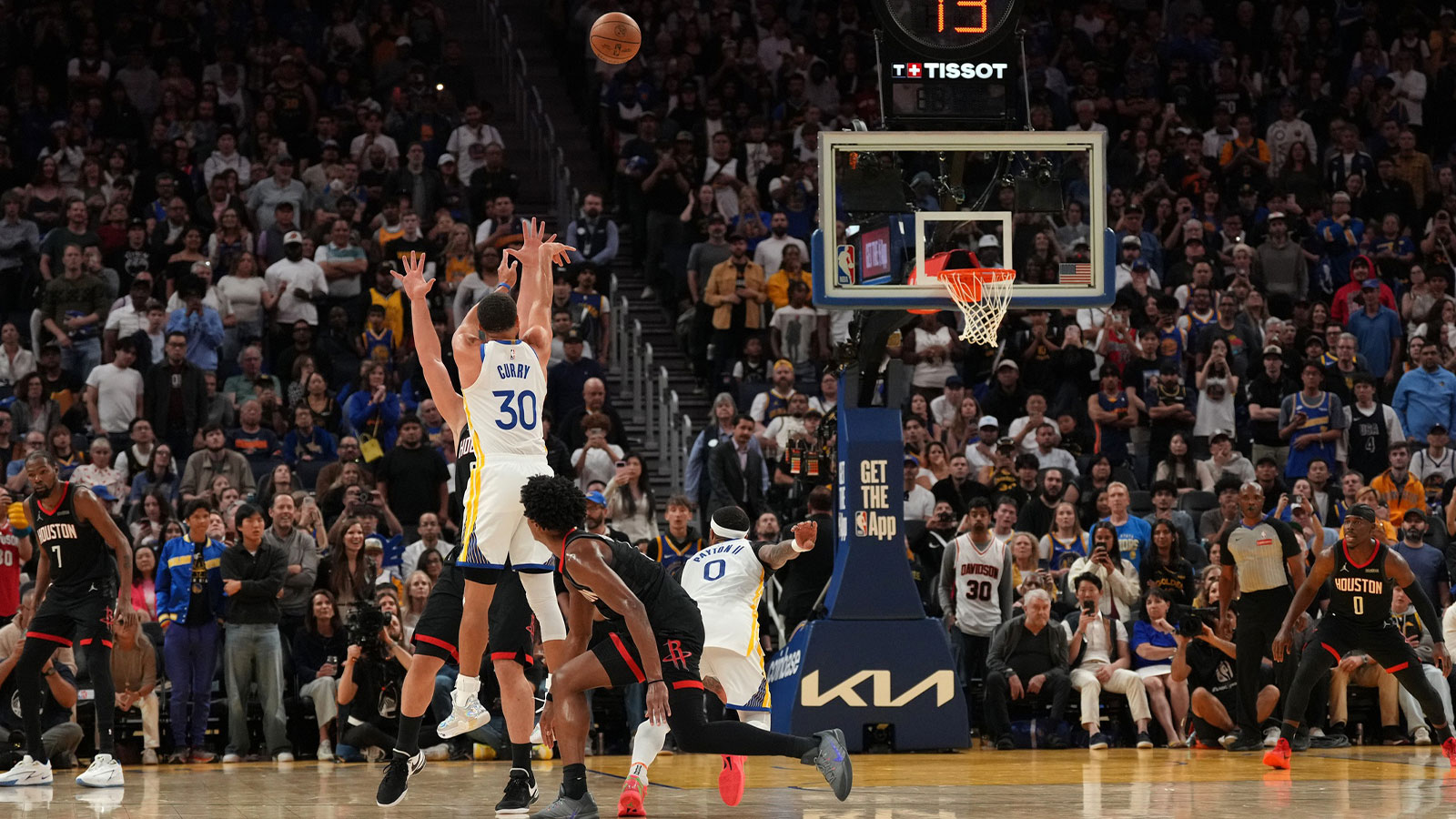 Golden State Warriors guard Stephen Curry (30) makes a three point shot against the Houston Rockets in the fourth quarter at the Chase Center. 