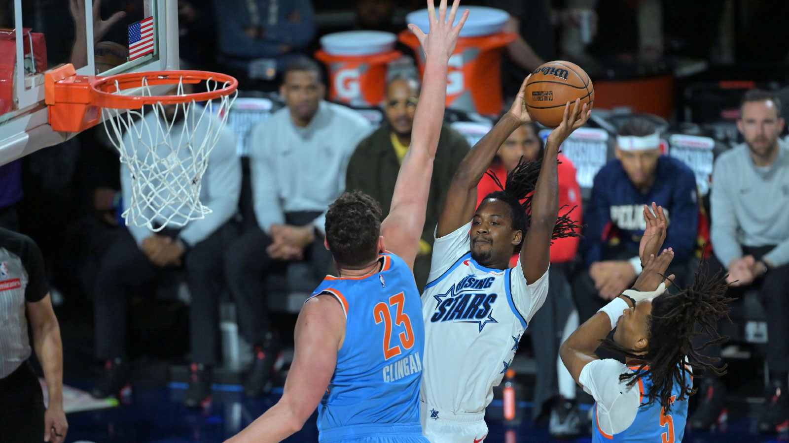 Team Austin guard Tristen Newton (13) of the Houston Rockets shoots against Team Melo frontcourt Donovan Clingan (23) of the Portland Trail Blazers during an NBA All Star Rising Stars game at Intuit Dome.