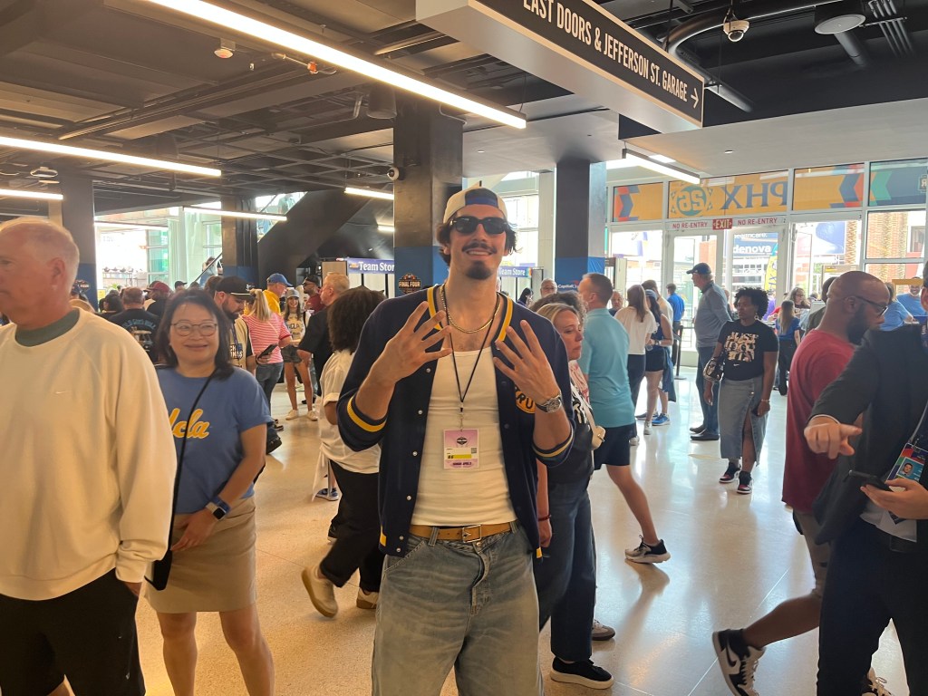 Jaime Jaquez in a crowded hall at a basketball game.