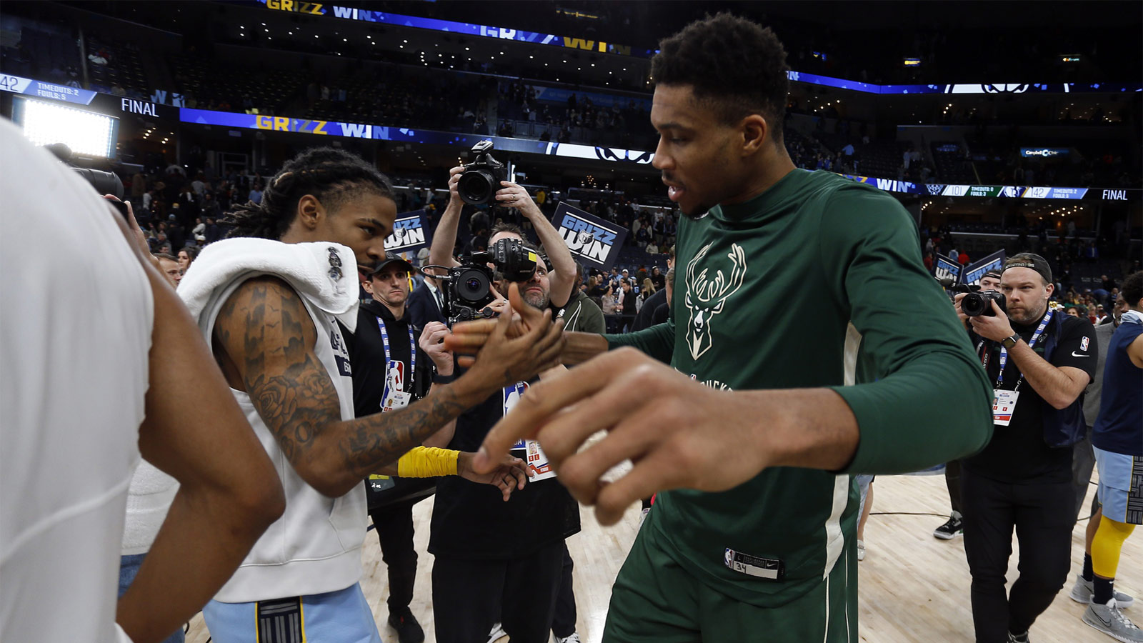 Memphis Grizzlies guard Ja Morant (left) and Milwaukee Bucks forward Giannis Antetokounmpo (34) shake hands after the game at FedExForum.