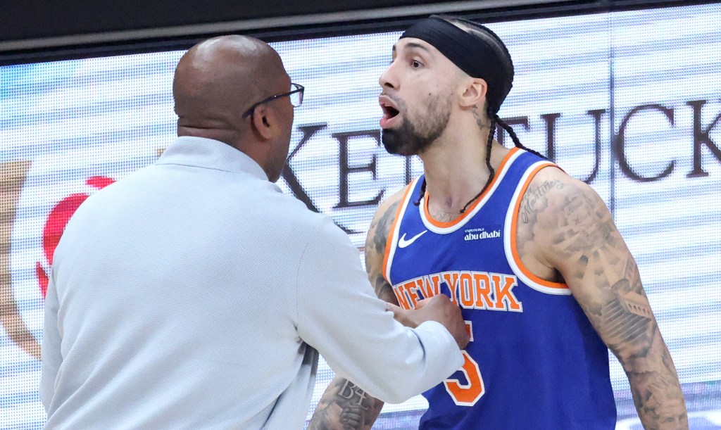 Jose Alvarado is held back by Mike Brown after he got into a bit of a dustup with Mouhamed Gueye in the first quarter of the Knicks' 114-98 Game 4 win over the Hawks, forcing the Atlanta forward into a technical foul.