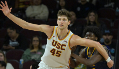 Dec 21, 2025; Los Angeles, California, USA; USC Trojans center Gabe Dynes (45) is defended by UC Santa Cruz Banana Slugs guard Teni SalakoChase Rawlins (22) in the second half at Galen Center. Mandatory Credit: Jayne Kamin-Oncea-Imagn Images