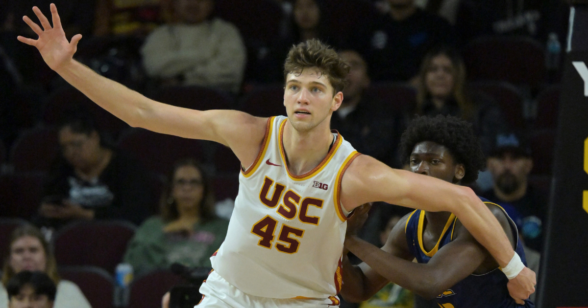 Dec 21, 2025; Los Angeles, California, USA; USC Trojans center Gabe Dynes (45) is defended by UC Santa Cruz Banana Slugs guard Teni SalakoChase Rawlins (22) in the second half at Galen Center. Mandatory Credit: Jayne Kamin-Oncea-Imagn Images