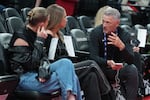 Portland Trail Blazers new owner Tom Dundon, right is seated before an NBA basketball game against the New Orleans Pelicans, Thursday, April 2, 2026, in Portland, Ore.