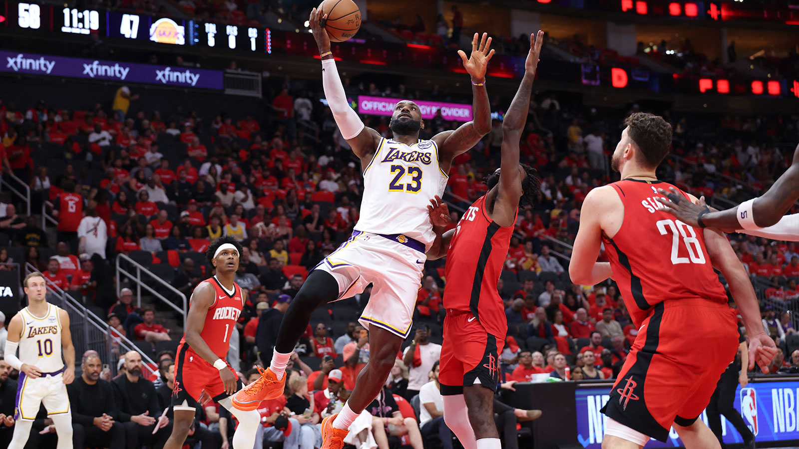 Los Angeles Lakers forward LeBron James (23) shoots the ball as Houston Rockets forward Tari Eason (17) defends during the third quarter during game four of the first round of the 2026 NBA Playoffs at Toyota Center.