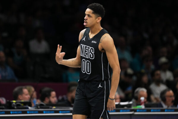Brooklyn Nets' Josh Minott (00) gestures after making a three-point shot during the first half of an NBA basketball game against the Charlotte Hornets Tuesday, March 31, 2026, in New York. (AP Photo/Frank Franklin II)