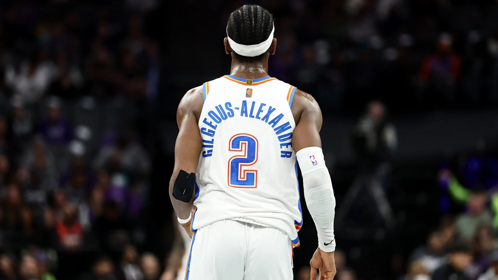 Shai Gilgeous-Alexander #2 of the Oklahoma City Thunder stands on the court during their game against the Sacramento Kings at Golden 1 Center on November 07, 2025 in Sacramento, California. The reigning MVP, Shai Gilgeous-Alexander, will wear a special gold NBA logo patch on his jersey for the 2025-26 season. (Photo by Ezra Shaw/Getty Images)