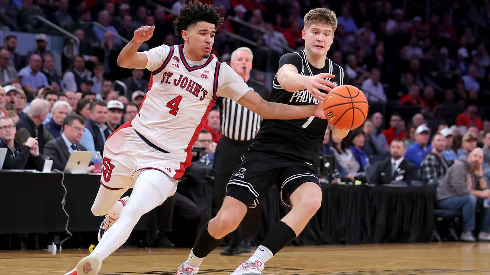 St. John's Red Storm guard Oziyah Sellers (4) and Providence Friars guard Stefan Vaaks (7) chase after a loose ball during the second half at Madison Square Garden. Mandatory Credit: Brad Penner-Imagn Images